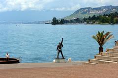 Mercury sculpture by a lake