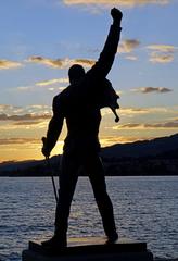 Freddie Mercury statue overlooking Lake Geneva during blue hour