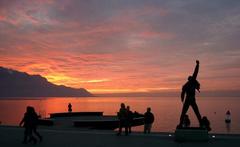 Freddie Mercury statue during sunset over Lake Geneva