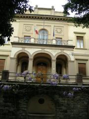 Osservatorio di Arcetri, a historical astronomical observatory in Florence, Italy, with its iconic domed structure surrounded by trees and clear sky