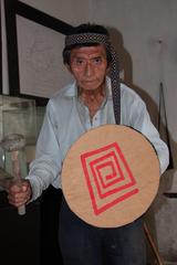 Founder of the Museo de los Colli, Enrique Niquin, standing in front of the museum