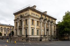 a group of people gathered outside a historic building at the University of Oxford