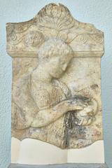 Grave stele of Nikeso holding a bird from 5th century B.C.