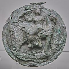 Aphrodite riding a goat on a folded mirror lid