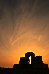 silhouette of a stone building at Besant Nagar Beach