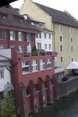 panoramic view of Baden bei Zürich with colorful buildings, a river, and surrounding hills