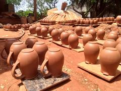 Earthen jugs baking in the sun at Auroville