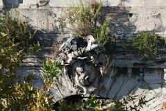 Close-up of a sculpture adorning the keystone of Ponte Rotto in Rome