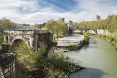 Antic gate crossing the Tiber river in Rome, Italy