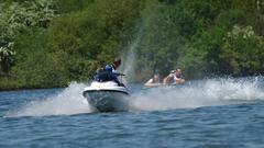 Jet Ski towing an inflatable on water