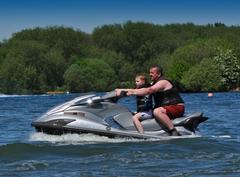 Guy and young lad on a Jet Ski