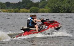 Jet Ski driver and passenger having fun at Kingsbury Water Park