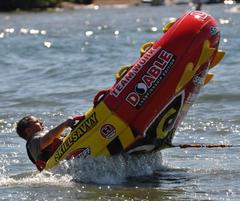 Jet Ski performing a doughnut maneuver on water