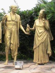 Sudama and his wife in traditional Indian attire