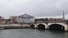 Palais Bourbon under renovation with Eiffel Tower and Pont de la Concorde in the background