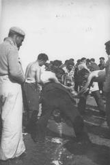 Spanish Republican refugees drinking from the first potable water taps installed in the Argelès-sur-Mer camp