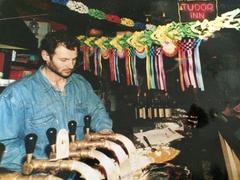 Dominique Lecrocq working behind the counter in the 1990s