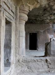 A man standing at a crossroads on Elephanta Island