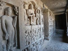 Elephanta Caves entrance with stone sculptures and tourists