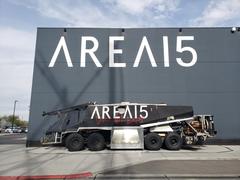 Truck parked outside of Area 15 with 'AREA15 does not exist' painted on it