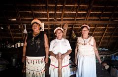 Dona Aparecida, Dona Vanísia, and Dona Maresiana inside the Oca of Ita'y village