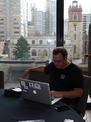 Attendee in the garden room during Wikimania 2014 hackathon