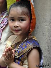 portrait of a child performing Lao dance at Fete Bouddha in Strasbourg