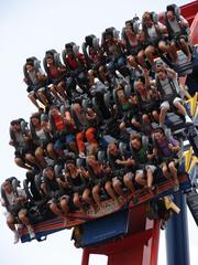 Floorless train of SheiKra on a steep drop