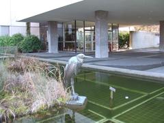 Bronze sculpture of Grey Heron in front of Natural History Museum in Geneva