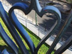 Fence viewed through a heart-shaped fence element