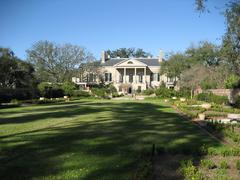 Longue Vue House & Gardens in New Orleans, viewed from the back with lush greenery