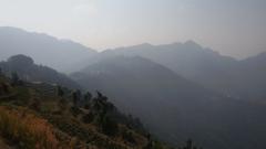 Scenic view of Mussoorie hills with dense forest and clear sky