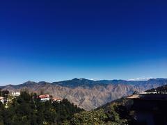 Picturesque drive from Mussoorie with distant brown hills in view