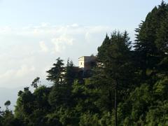 old house between trees in Mussoorie