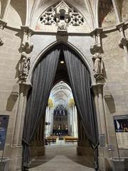 interior view of Cathédrale de Lausanne with sunlight streaming through stained glass windows