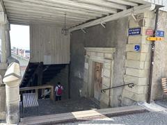 Historic stone stairway under Maison Levade