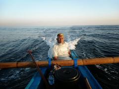 Balinese fisherman fishing off Jimbaran