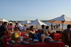 Jimbaran beach panoramic view with boats and clear blue sky