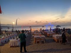 Restaurant in Jimbaran during sunset with visible sunbeams