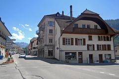 Scenic street view of Charmey, Switzerland with mountains in the background