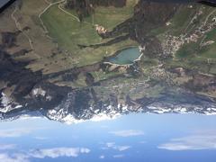 Aerial view of Charmey village surrounded by lush green mountains