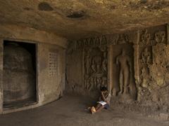 Boy studying at Mahakali Caves in Mumbai