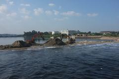 A panoramic view of Chennai Marina Beach with people enjoying the seaside atmosphere