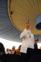 Visitor recording video with a mobile phone inside the 6 October War Panorama in Cairo