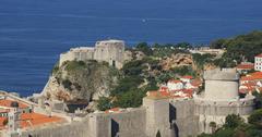 View of Dubrovnik city walls with Lovrijenac Fortress on rocky outcrop