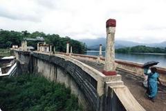 Mangalam Dam in Kerala surrounded by lush greenery and water