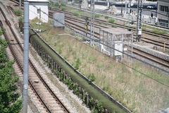 remnants of Manseibashi Station platform with Tokyo skyline in background