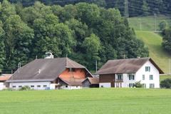 Aerial view of Broc, Switzerland with lush green fields and surrounding hills