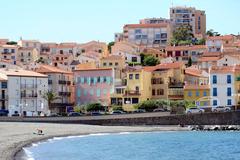 Scenic view of Banyuls-sur-Mer, France with waterfront buildings and clear blue sky