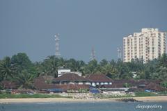 view of Mappila Bay with boats docked and a distant townscape